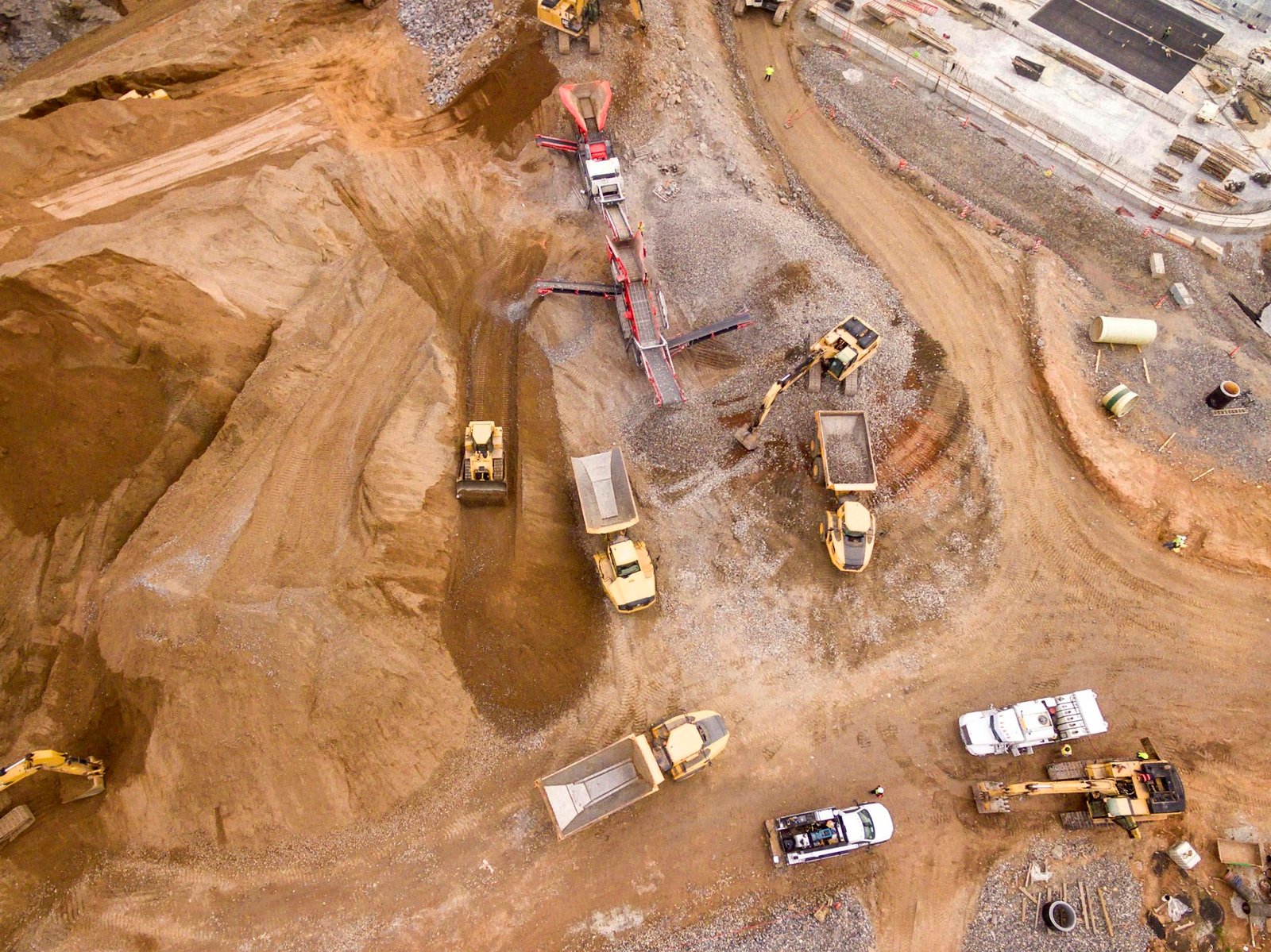 Aerial view of haul trucks working a mine site
